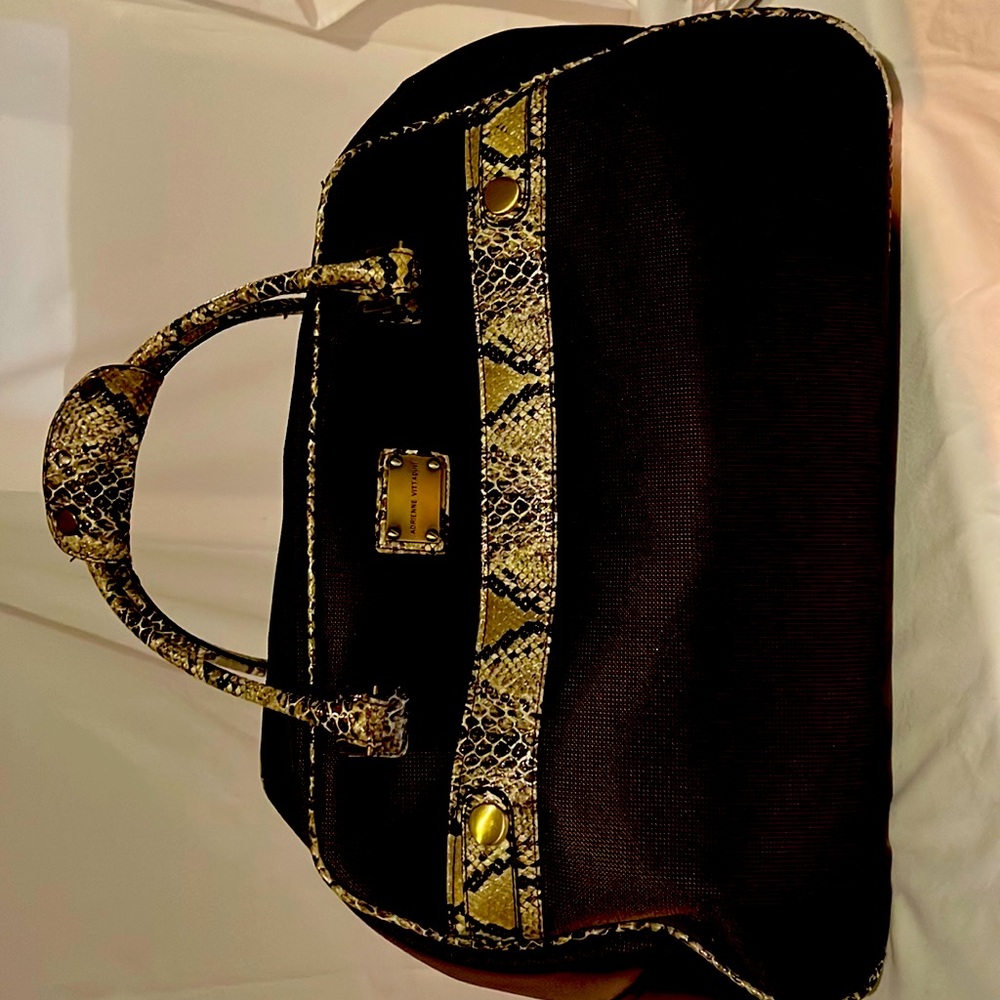 Travel weekend bag wheels and pull handle zip pocket on front .Large